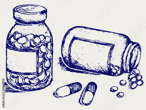 Pill bottle. Spilling pills on to surface