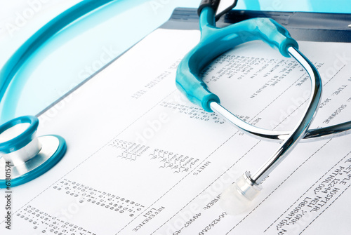 Blood test results in a clipboard with stethoscope photo