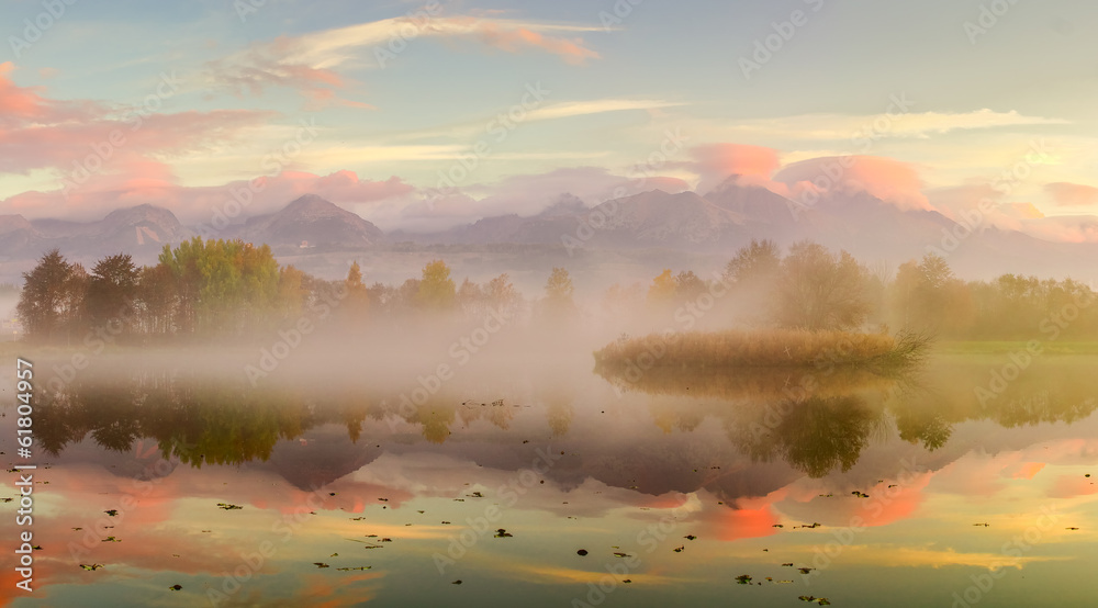 Autumn landscape and foggy  lake