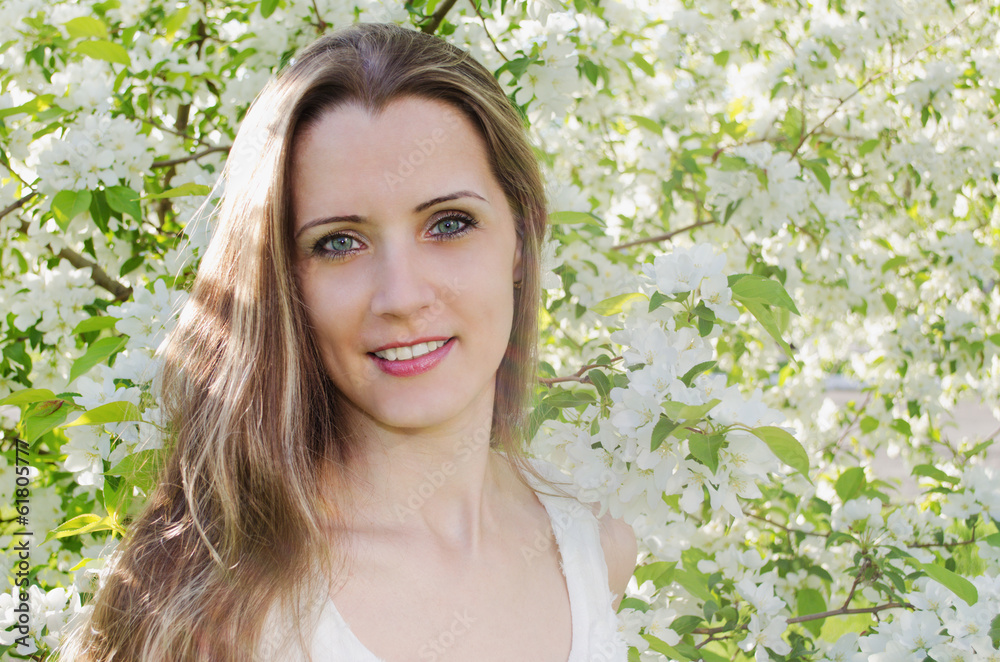 Portrait of beautiful woman with apple tree flowers Portrait of beautiful woman with apple tree flowers