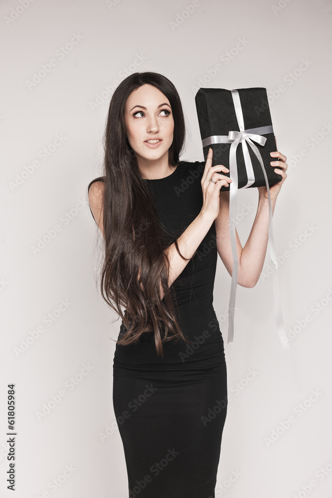 Elegant woman holding gift Elegant woman holding gift