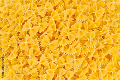 uncooked macaroni, farfalle on a white background