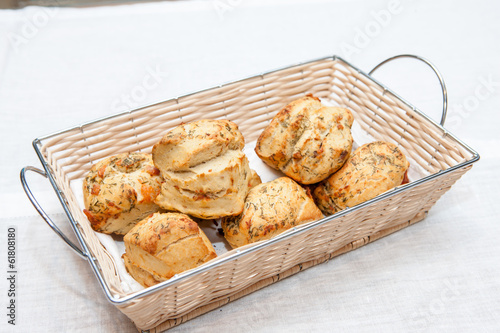 Crusty bread rolls with fresh tomato garnish