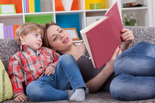 Mother and child reading a book photo