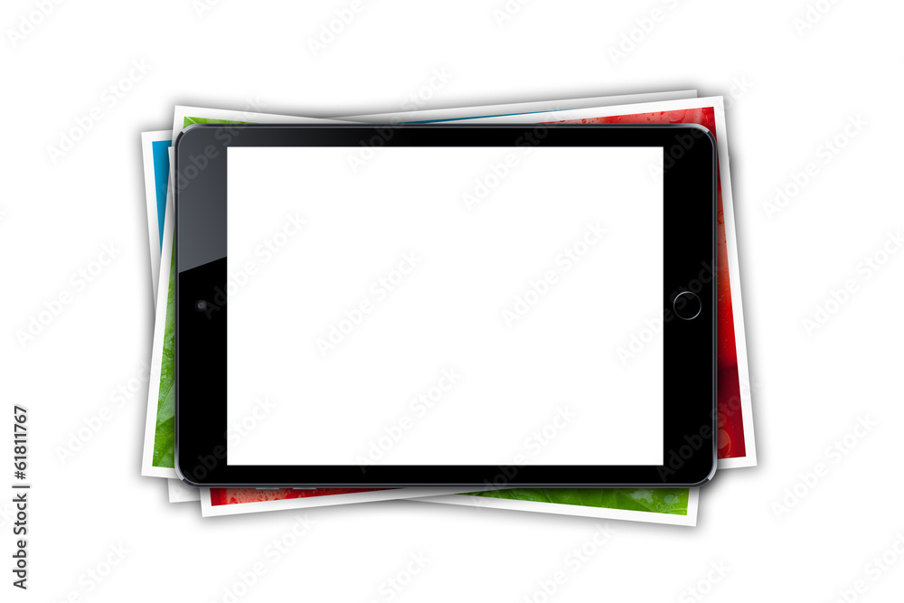 Tablet with blank screen and stack of printed pictures collage Tablet with blank screen and stack of printed pictures collage