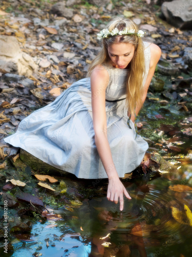Beautiful Fairytale Princess Sitting By Water Pond - obrazy, fototapety, plakaty 