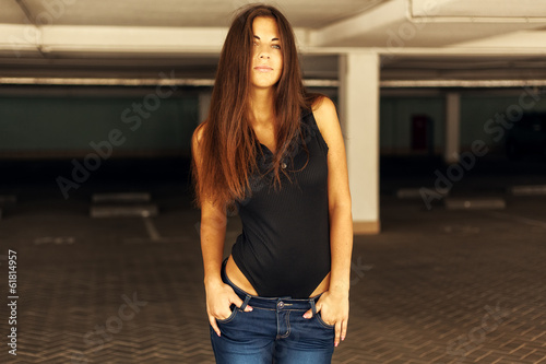 Beautiful fashionable girl on a sunny day with long hair