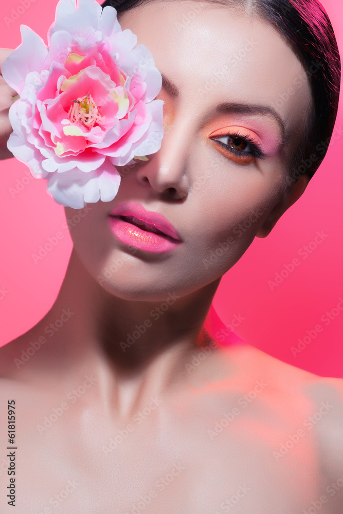 Fototapeta premium beautiful woman with stylish make-up and bright flowers