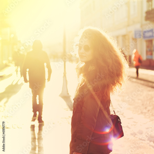 Beautiful girl hipster on the street with a camera