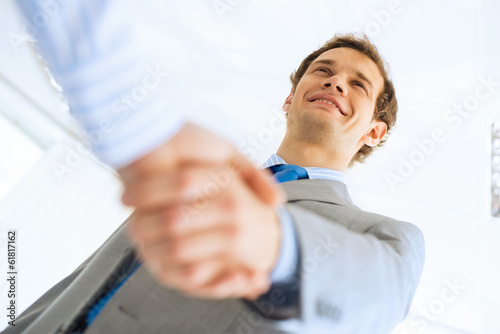 businessman shaking hands with a colleague