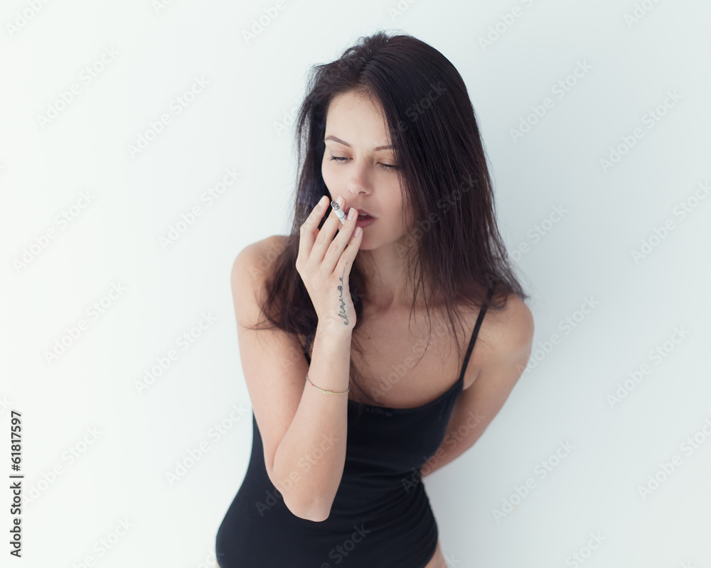 Close-up portrait of a beautiful sexy girl with a cigarette Close-up portrait of a beautiful sexy girl with a cigarette