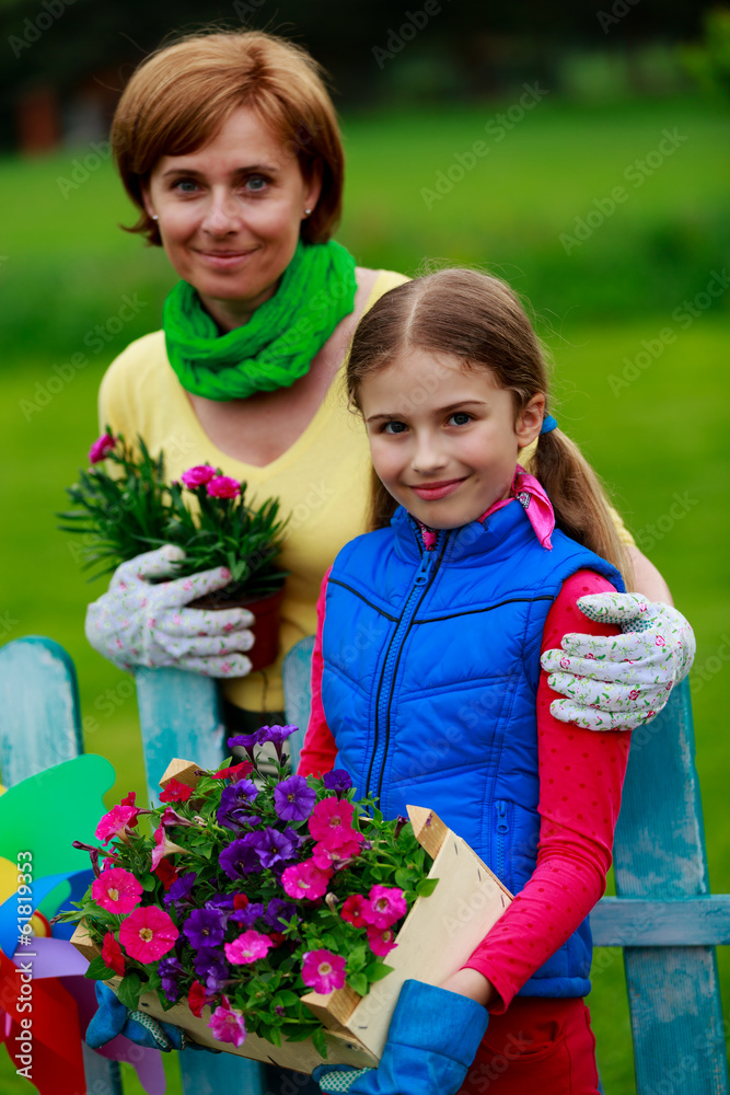 Gardening- family working in flowers garden