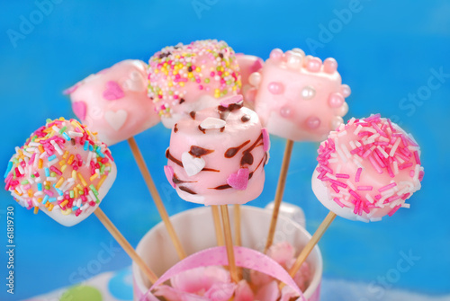 birthday party table with pink marshmallow pops for kids