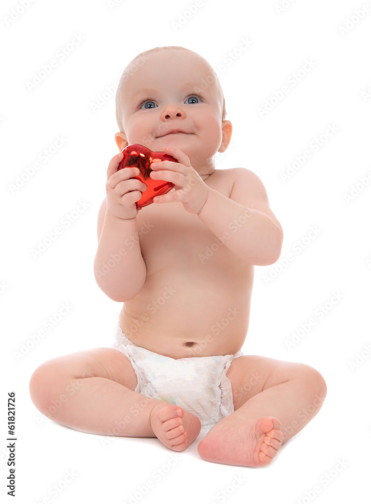 Young child baby toddler sitting with red heart gift for Valenti Young child baby toddler sitting with red heart gift for Valenti
