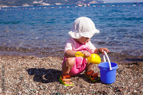 Baby play on seashore photo