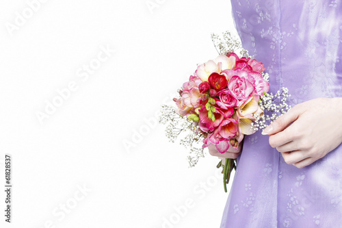 Bilde på lerret Beautiful young woman holding bouquet of flowers, isolated on wh