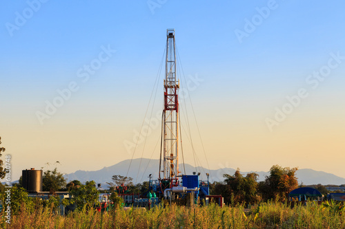 Oil Land Drilling Rig Working In The Field