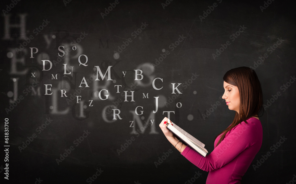 Young lady reading a book with alphabet letters Young lady reading a book with alphabet letters