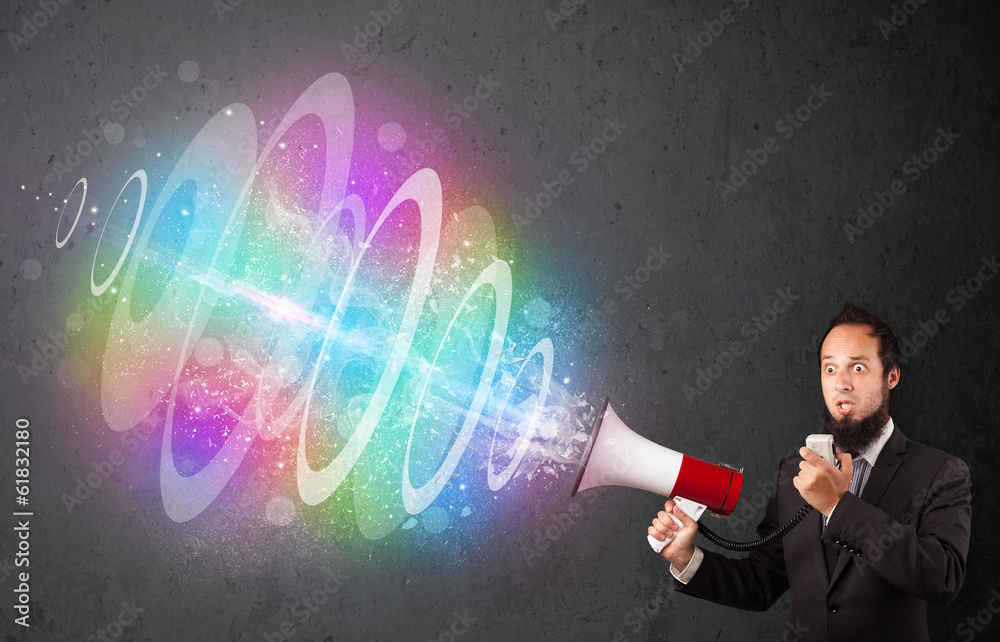 Man yells into a loudspeaker and colorful energy beam comes out Man yells into a loudspeaker and colorful energy beam comes out