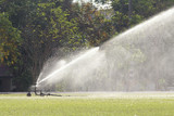 sprinkler head watering the grass