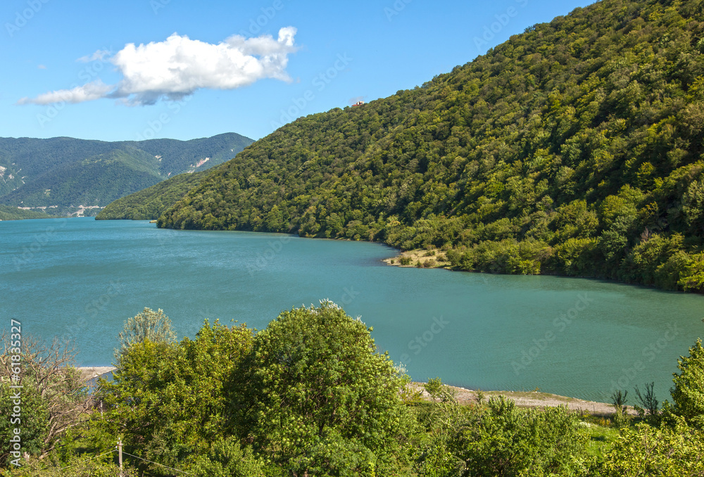 view of the blue lake and green hills on the background of blue