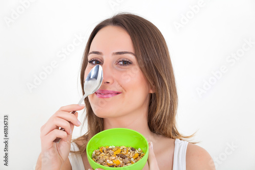 Healthy woman eating cereal