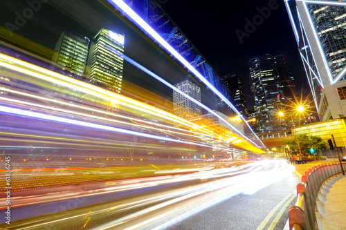 Fast moving car light in city