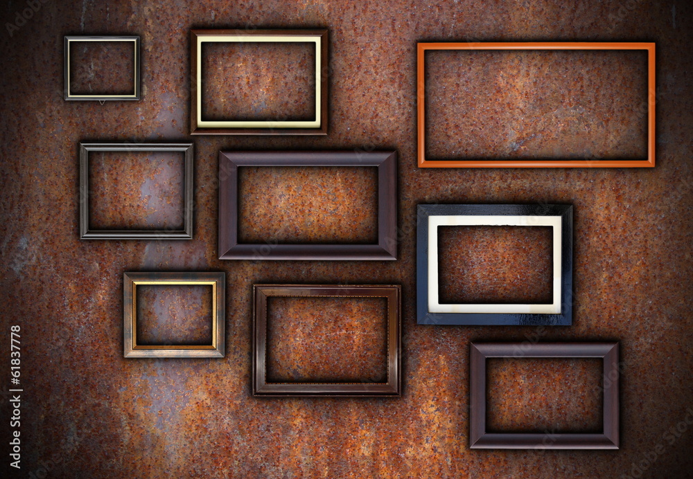 rusty wall full of empty frames rusty wall full of empty frames