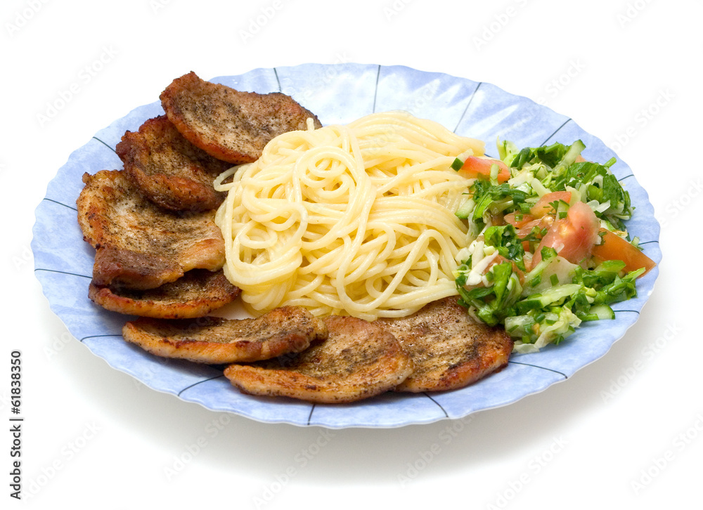 Spaghetti with fried pork fillet and fresh vegetables