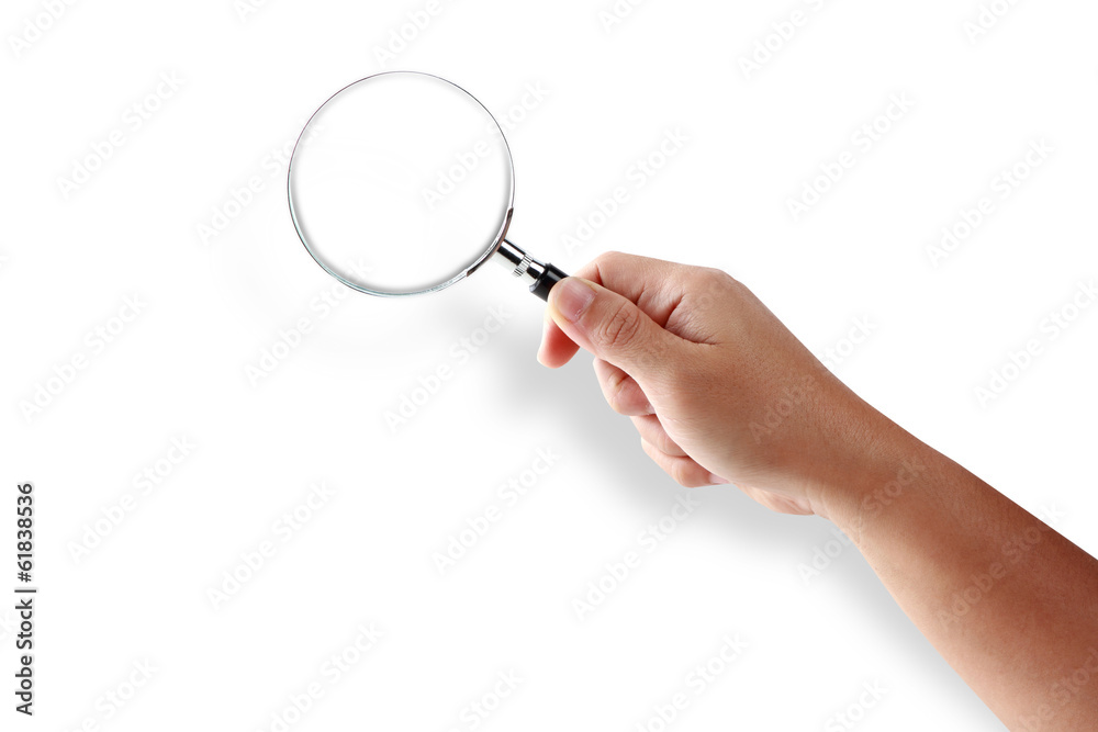 Hand holding magnifying glass isolated on white background Hand holding magnifying glass isolated on white background