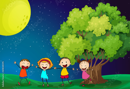 Kids playing happily near the tree