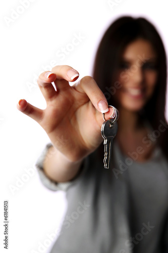 Closeup portrait of a female hand holding keys