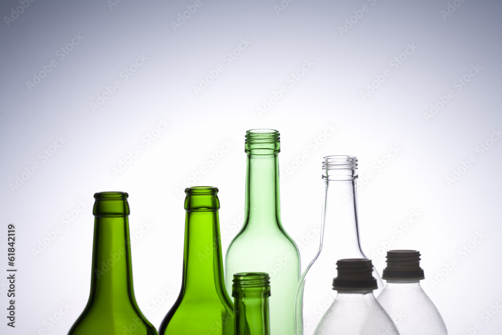beautiful bottles and plastic bottles placed in a line beautiful bottles and plastic bottles placed in a line