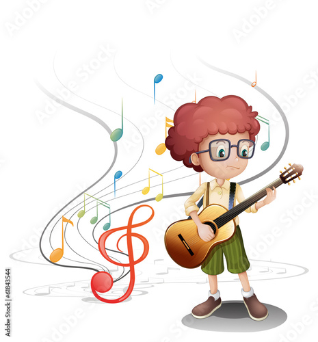 A young musician playing a guitar