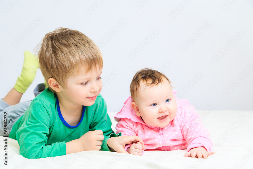 portrait of little boy with newborn sister portrait of little boy with newborn sister