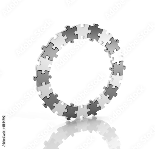 Black and white puzzle pieces in a circle isolated
