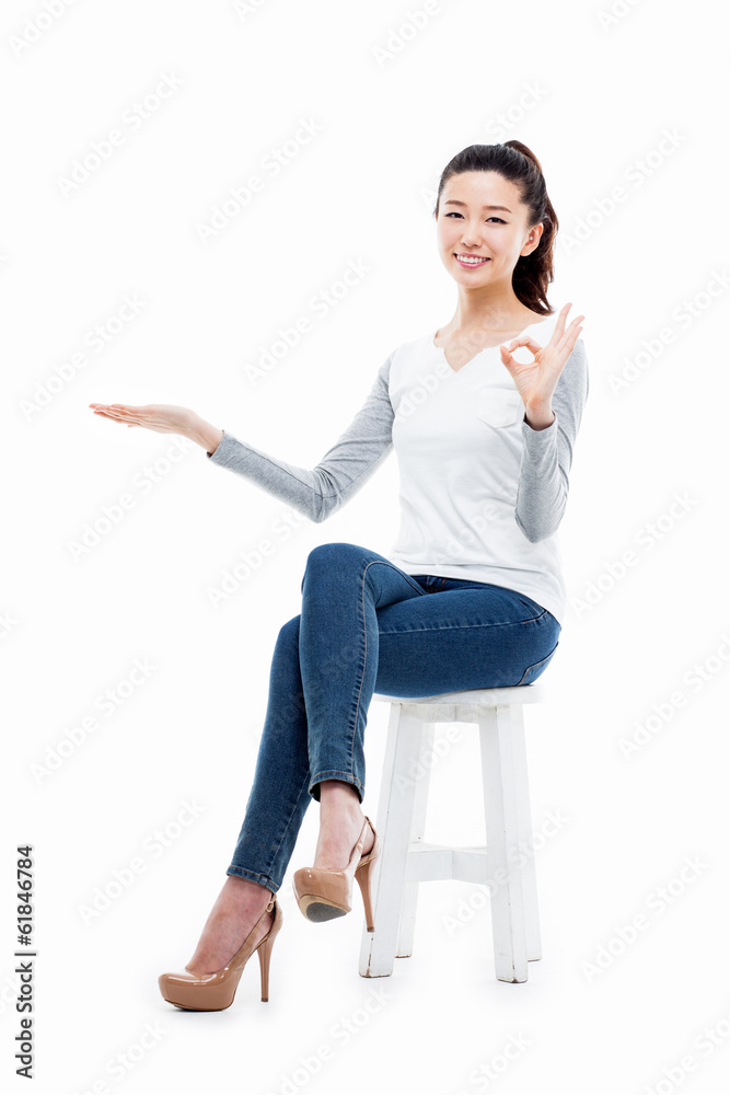 Asian woman present something. Asian woman present something.