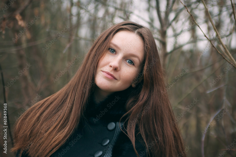 Portrait of a beautiful model with freckles on her face. Outdoor Portrait of a beautiful model with freckles on her face. Outdoor