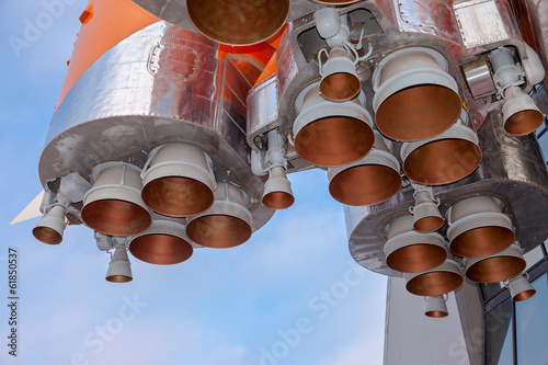 Fototapeta Naklejka Na Ścianę i Meble -  Details of space rocket engine over blue sky background