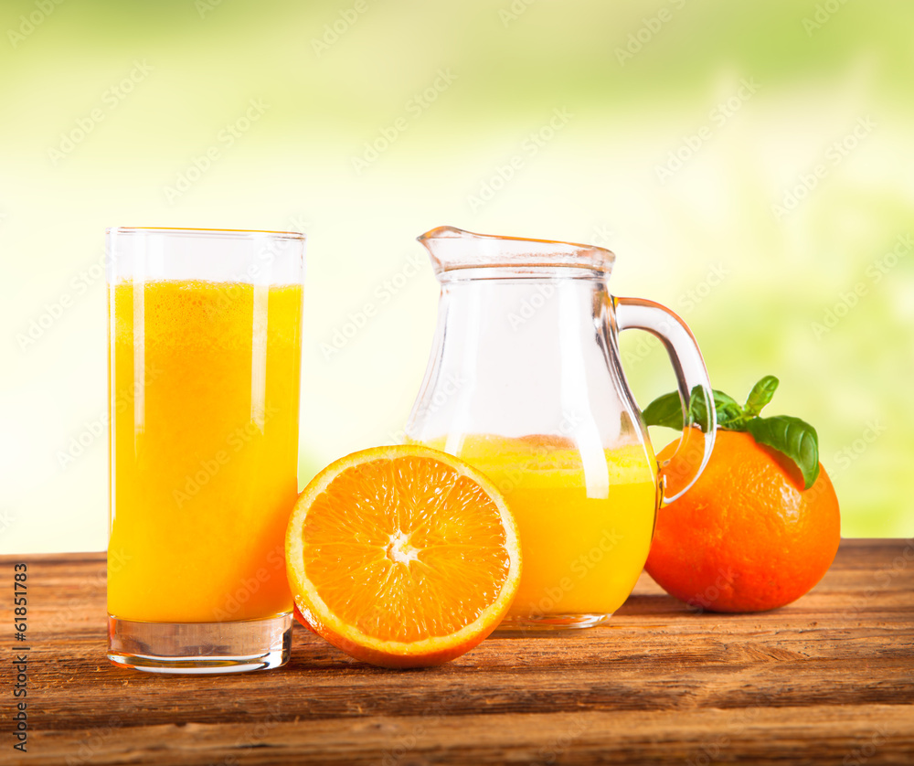 Fresh orange juice and fruits on wood plant Fresh orange juice and fruits on wood plant