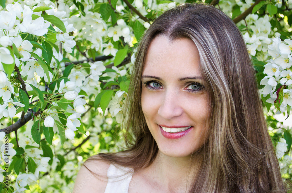 Portrait of beautiful woman with apple tree flowers Portrait of beautiful woman with apple tree flowers