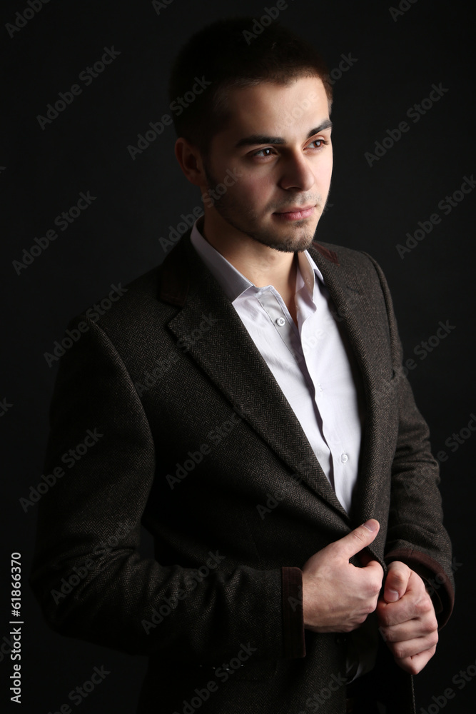 Handsome young man on dark background Handsome young man on dark background