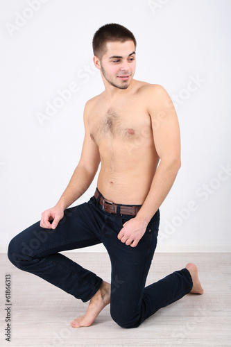 Handsome young man on light background