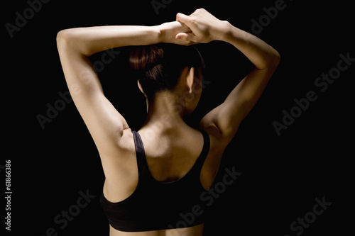 Japanese woman raising her both arms