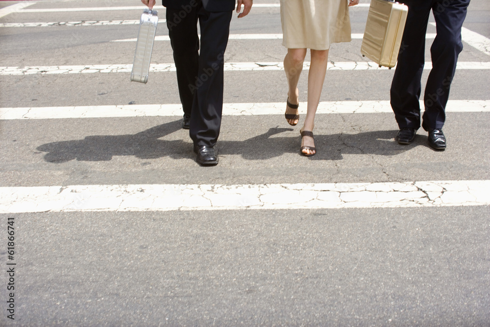 legs of businessmen crossing at the cross walk legs of businessmen crossing at the cross walk