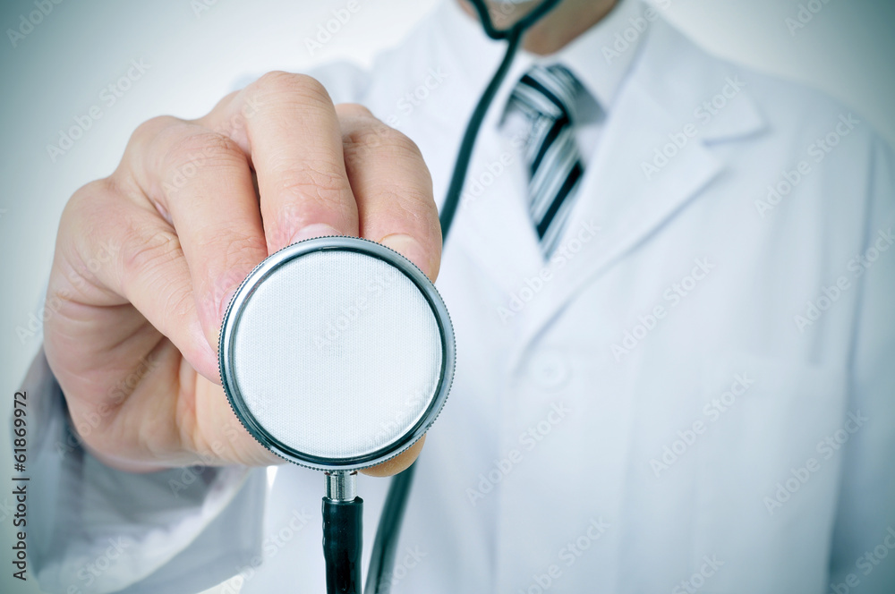 doctor using a stethoscope doctor using a stethoscope