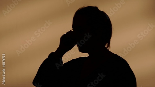 Female silhouette calling on the phone