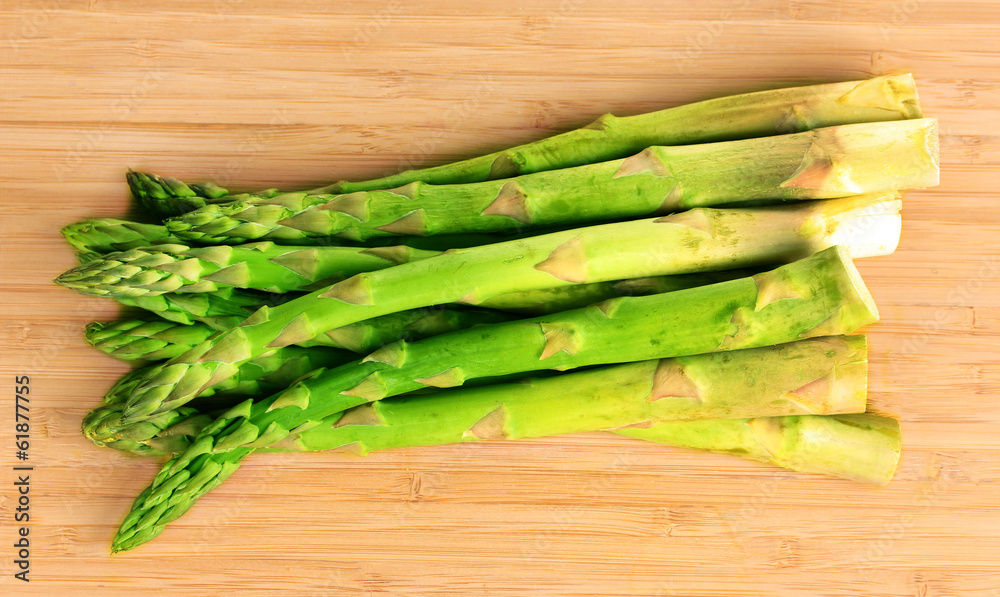 delicious asparagus on wooden background delicious asparagus on wooden background