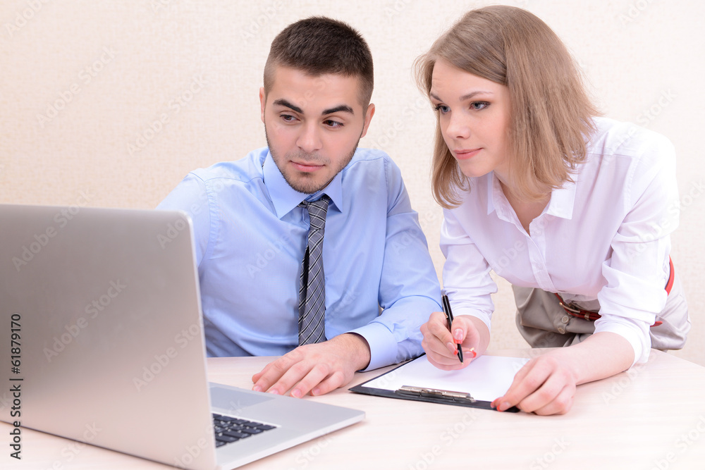 Successful young businesspeople working at office Successful young businesspeople working at office
