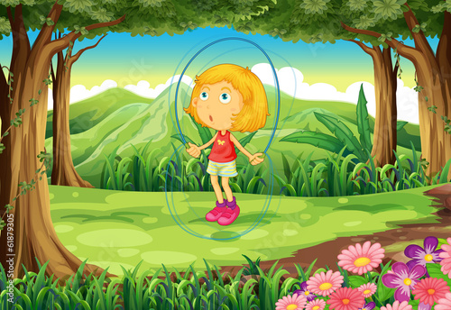 A girl playing in the middle of the forest